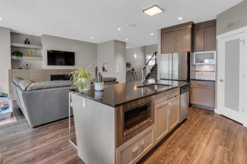 145 Wildrose Drive, Strathmore, AB - Indoor Photo Showing Kitchen With Fireplace With Upgraded Kitchen