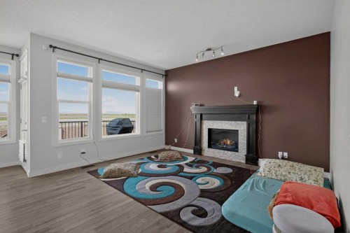 152 Redstone Villas Ne, Calgary, AB - Indoor Photo Showing Living Room With Fireplace