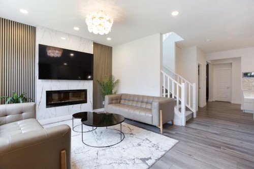 37 Savanna Heath Ne, Calgary, AB - Indoor Photo Showing Living Room With Fireplace