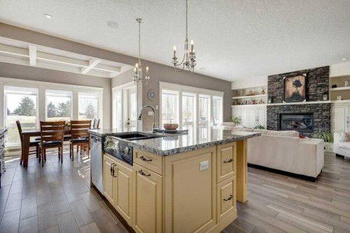 1233 Hillcrest Manor Estates, Strathmore, AB - Indoor Photo Showing Kitchen With Fireplace