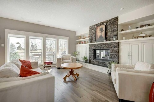 1233 Hillcrest Manor Estates, Strathmore, AB - Indoor Photo Showing Living Room With Fireplace