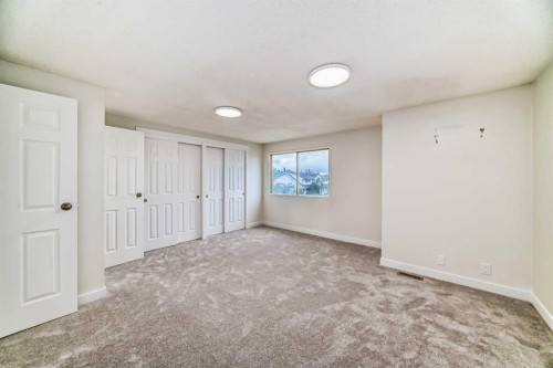 32-1515 Falconridge Drive Ne, Calgary, AB - Indoor Photo Showing Other Room