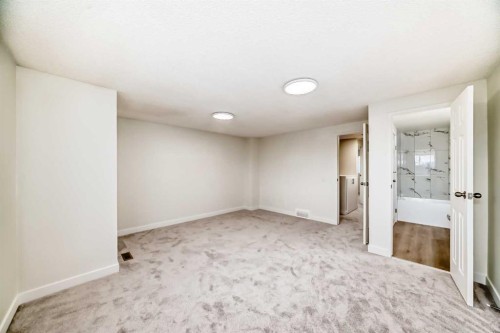 32-1515 Falconridge Drive Ne, Calgary, AB - Indoor Photo Showing Other Room