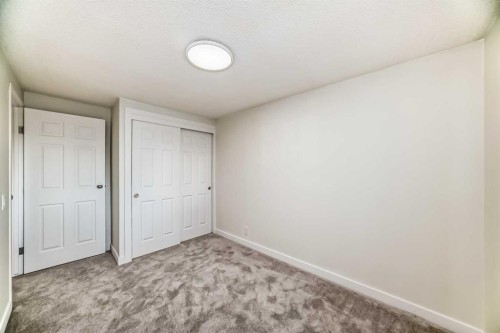 32-1515 Falconridge Drive Ne, Calgary, AB - Indoor Photo Showing Other Room