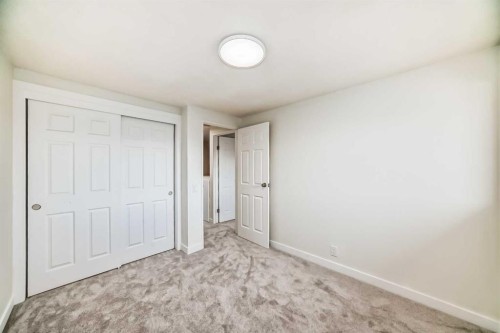 32-1515 Falconridge Drive Ne, Calgary, AB - Indoor Photo Showing Other Room