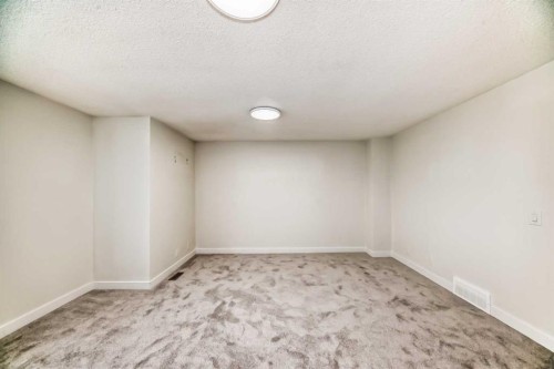 32-1515 Falconridge Drive Ne, Calgary, AB - Indoor Photo Showing Other Room