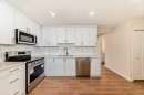 32-1515 Falconridge Drive Ne, Calgary, AB  - Indoor Photo Showing Kitchen With Double Sink 