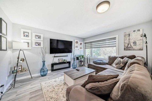447 Malvern Close Ne, Calgary, AB - Indoor Photo Showing Living Room With Fireplace
