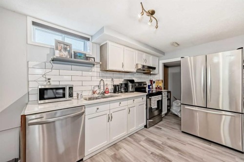 447 Malvern Close Ne, Calgary, AB - Indoor Photo Showing Kitchen With Stainless Steel Kitchen With Double Sink