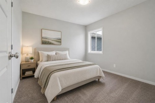 98 Seton Road Se, Calgary, AB - Indoor Photo Showing Bedroom