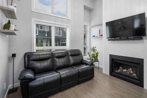 175 Silverado Plains Park Sw, Calgary, AB - Indoor Photo Showing Living Room With Fireplace