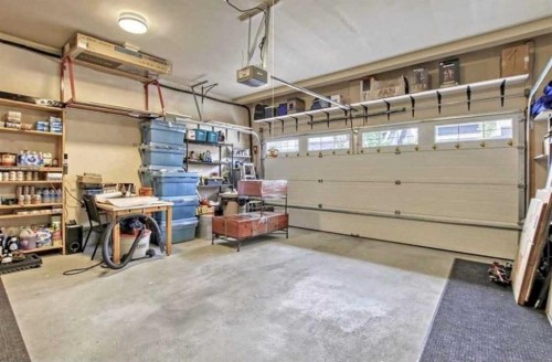 175 Silverado Plains Park Sw, Calgary, AB - Indoor Photo Showing Garage