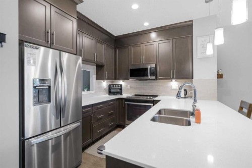 175 Silverado Plains Park Sw, Calgary, AB - Indoor Photo Showing Kitchen With Stainless Steel Kitchen With Double Sink With Upgraded Kitchen