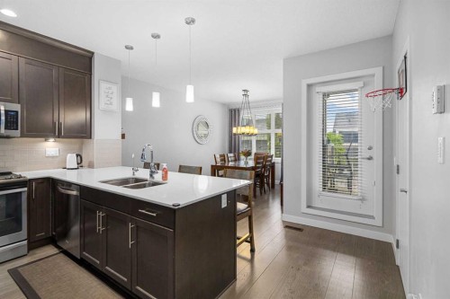 175 Silverado Plains Park Sw, Calgary, AB - Indoor Photo Showing Kitchen With Double Sink With Upgraded Kitchen