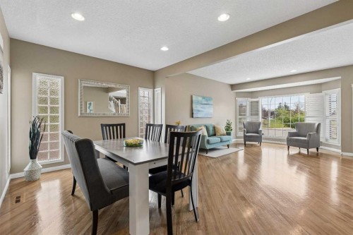 438 Candle Place Sw, Calgary, AB - Indoor Photo Showing Living Room With Fireplace