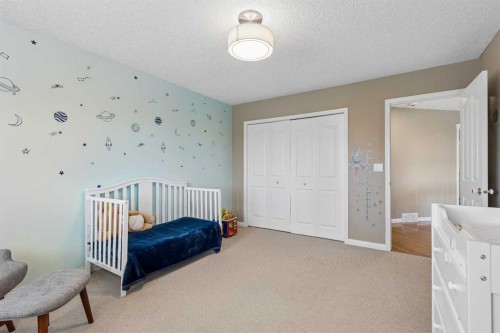 438 Candle Place Sw, Calgary, AB - Indoor Photo Showing Bedroom