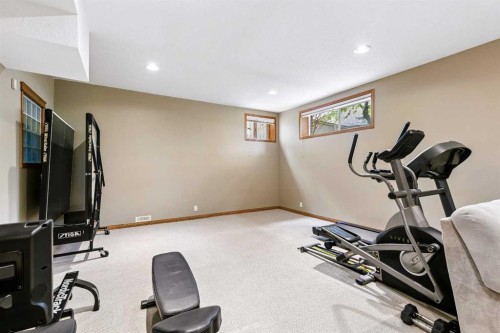 438 Candle Place Sw, Calgary, AB - Indoor Photo Showing Gym Room