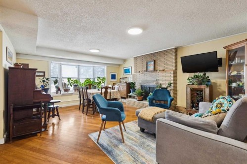 3232 15 Street Nw, Calgary, AB - Indoor Photo Showing Living Room With Fireplace