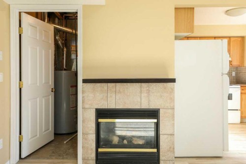 8-720 Heritage Boulevard West, Lethbridge, AB - Indoor With Fireplace