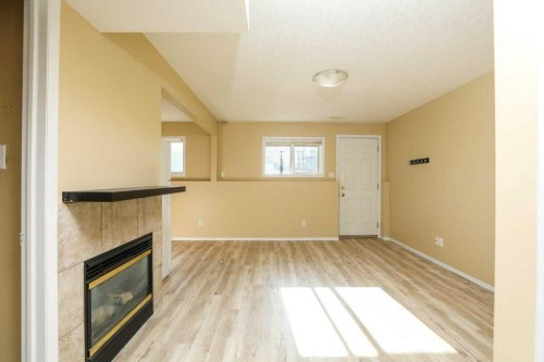 8-720 Heritage Boulevard West, Lethbridge, AB - Indoor Photo Showing Other Room With Fireplace