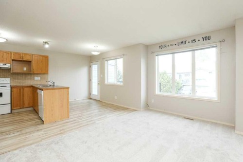 8-720 Heritage Boulevard West, Lethbridge, AB - Indoor Photo Showing Kitchen With Double Sink