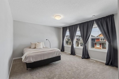65 Fireside Crescent, Cochrane, AB - Indoor Photo Showing Bedroom