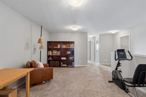 65 Fireside Crescent, Cochrane, AB - Indoor Photo Showing Gym Room