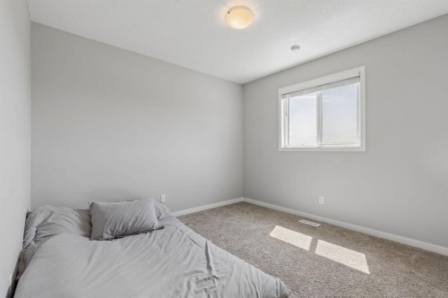 65 Fireside Crescent, Cochrane, AB - Indoor Photo Showing Bedroom