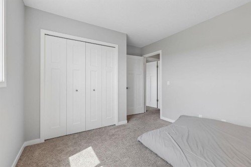 65 Fireside Crescent, Cochrane, AB - Indoor Photo Showing Bedroom