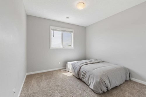 65 Fireside Crescent, Cochrane, AB - Indoor Photo Showing Bedroom