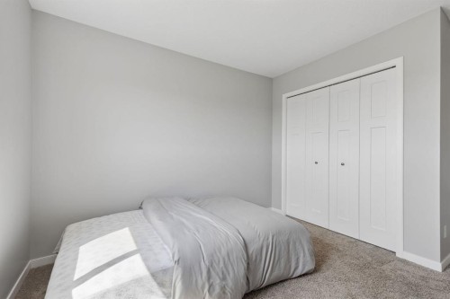 65 Fireside Crescent, Cochrane, AB - Indoor Photo Showing Bedroom