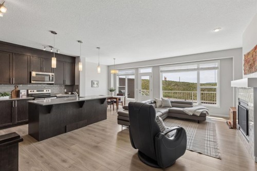 65 Fireside Crescent, Cochrane, AB - Indoor With Fireplace