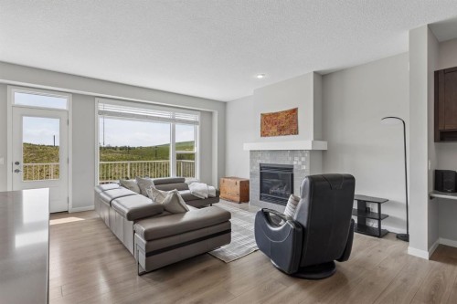 65 Fireside Crescent, Cochrane, AB - Indoor Photo Showing Living Room With Fireplace