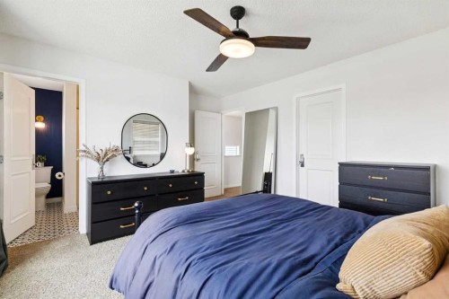 411 Silverado Drive Sw, Calgary, AB - Indoor Photo Showing Bedroom