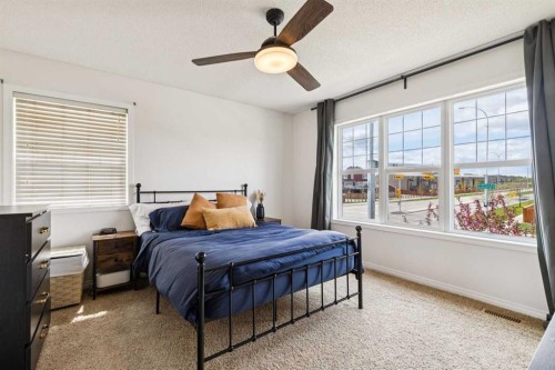 411 Silverado Drive Sw, Calgary, AB - Indoor Photo Showing Bedroom