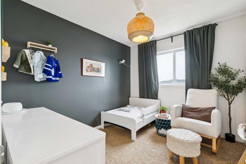411 Silverado Drive Sw, Calgary, AB - Indoor Photo Showing Bedroom