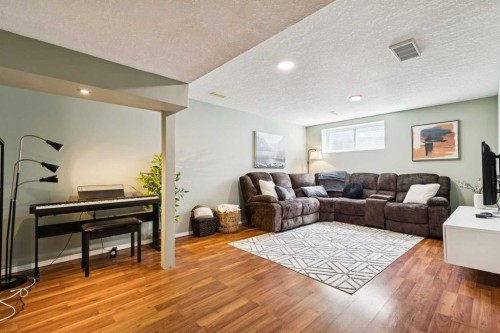 411 Silverado Drive Sw, Calgary, AB - Indoor Photo Showing Living Room