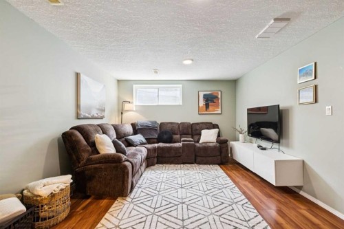 411 Silverado Drive Sw, Calgary, AB - Indoor Photo Showing Living Room