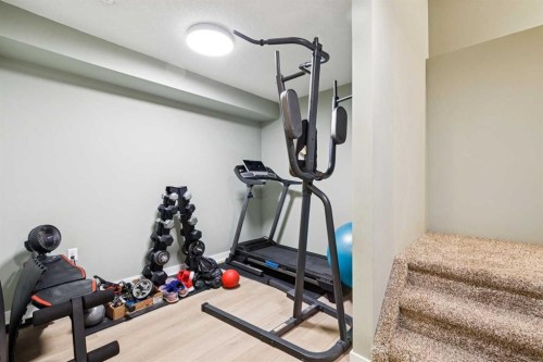 411 Silverado Drive Sw, Calgary, AB - Indoor Photo Showing Gym Room