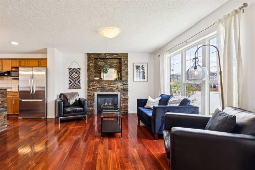 411 Silverado Drive Sw, Calgary, AB - Indoor Photo Showing Living Room With Fireplace