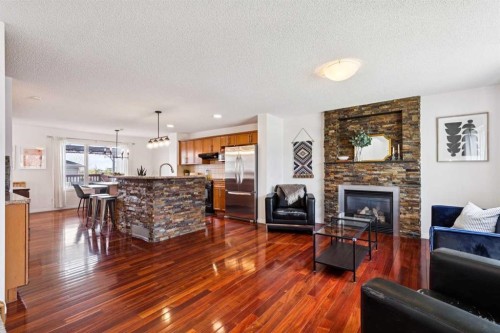411 Silverado Drive Sw, Calgary, AB - Indoor Photo Showing Living Room With Fireplace