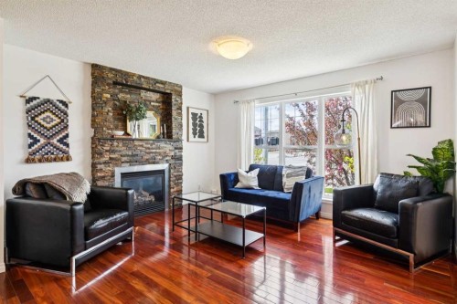 411 Silverado Drive Sw, Calgary, AB - Indoor Photo Showing Living Room With Fireplace