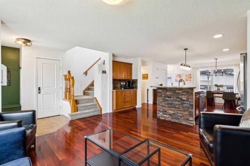 411 Silverado Drive Sw, Calgary, AB - Indoor Photo Showing Living Room