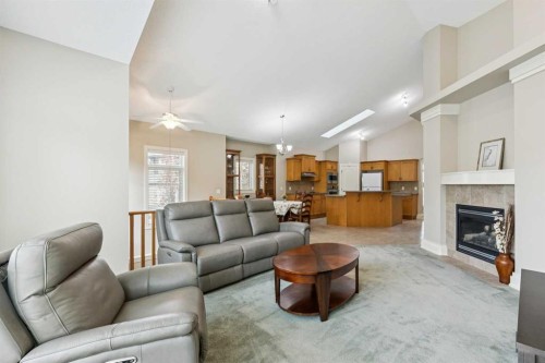 94 Panatella Close Nw, Calgary, AB - Indoor Photo Showing Living Room With Fireplace