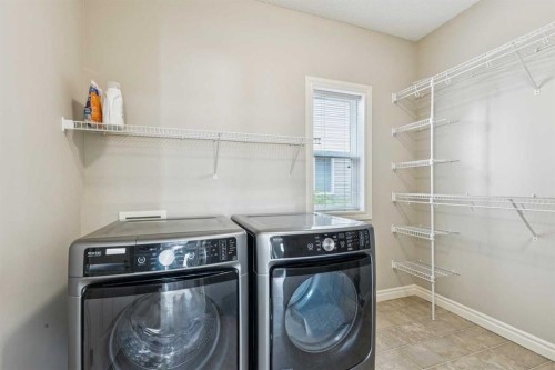 94 Panatella Close Nw, Calgary, AB - Indoor Photo Showing Laundry Room
