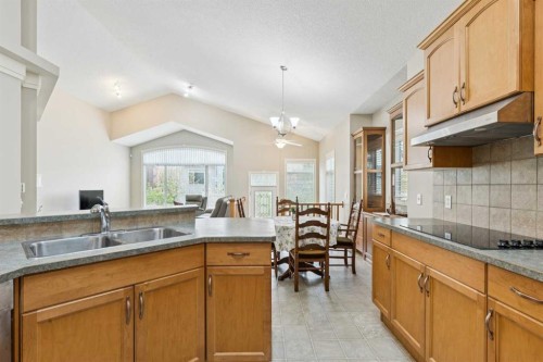 94 Panatella Close Nw, Calgary, AB - Indoor Photo Showing Kitchen With Double Sink