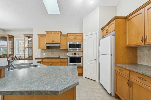 94 Panatella Close Nw, Calgary, AB - Indoor Photo Showing Kitchen With Stainless Steel Kitchen With Double Sink
