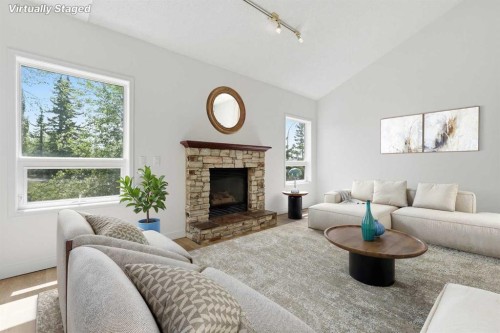 142 Elizabeth Way Se, Airdrie, AB - Indoor Photo Showing Living Room With Fireplace