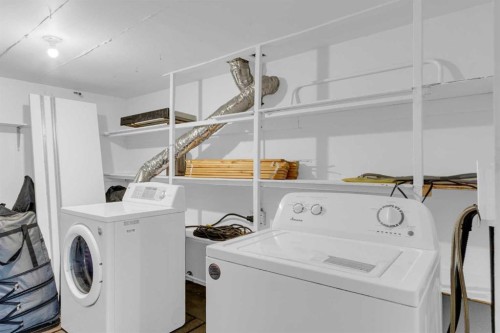 25 Deerfield Manor Se, Calgary, AB - Indoor Photo Showing Laundry Room