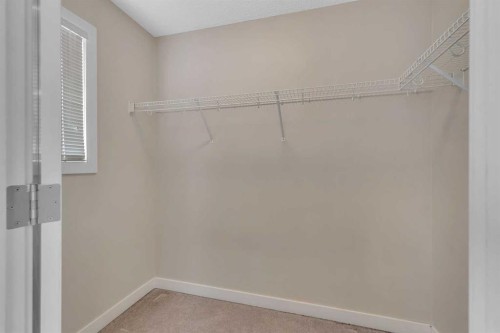 9 Cimarron Vista Gardens, Okotoks, AB - Indoor With Storage